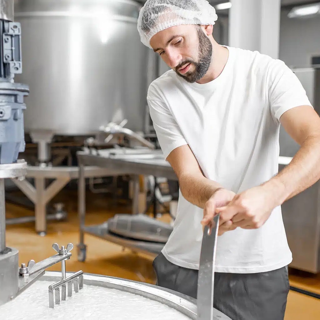 Arla case Study, man in dairy factory